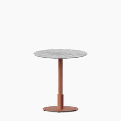 Round dining table with marble top and metal pedestal base.