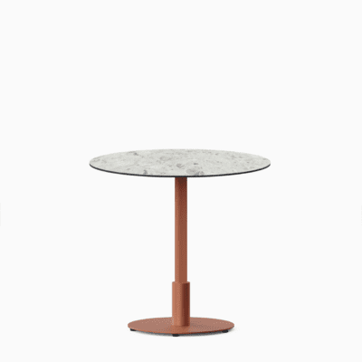 Round dining table with compact‑laminate top and metal pedestal base.