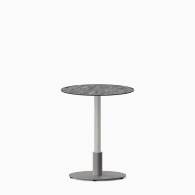 Round dining table with compact‑laminate top and metal pedestal base.
