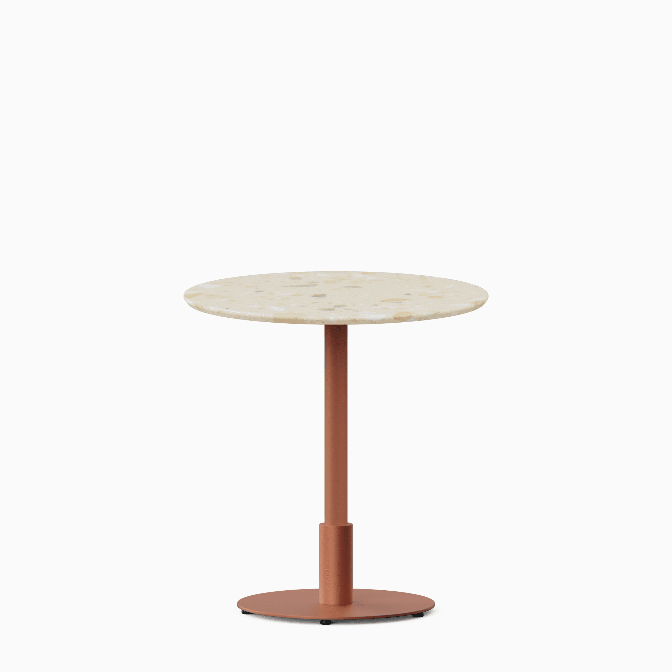 Round dining table with terrazzo top and metal pedestal base.
