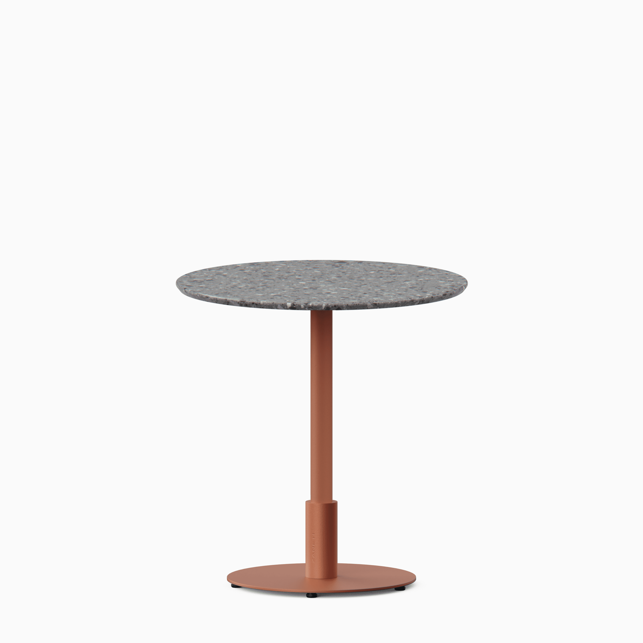 Round dining table with terrazzo top and metal pedestal base.