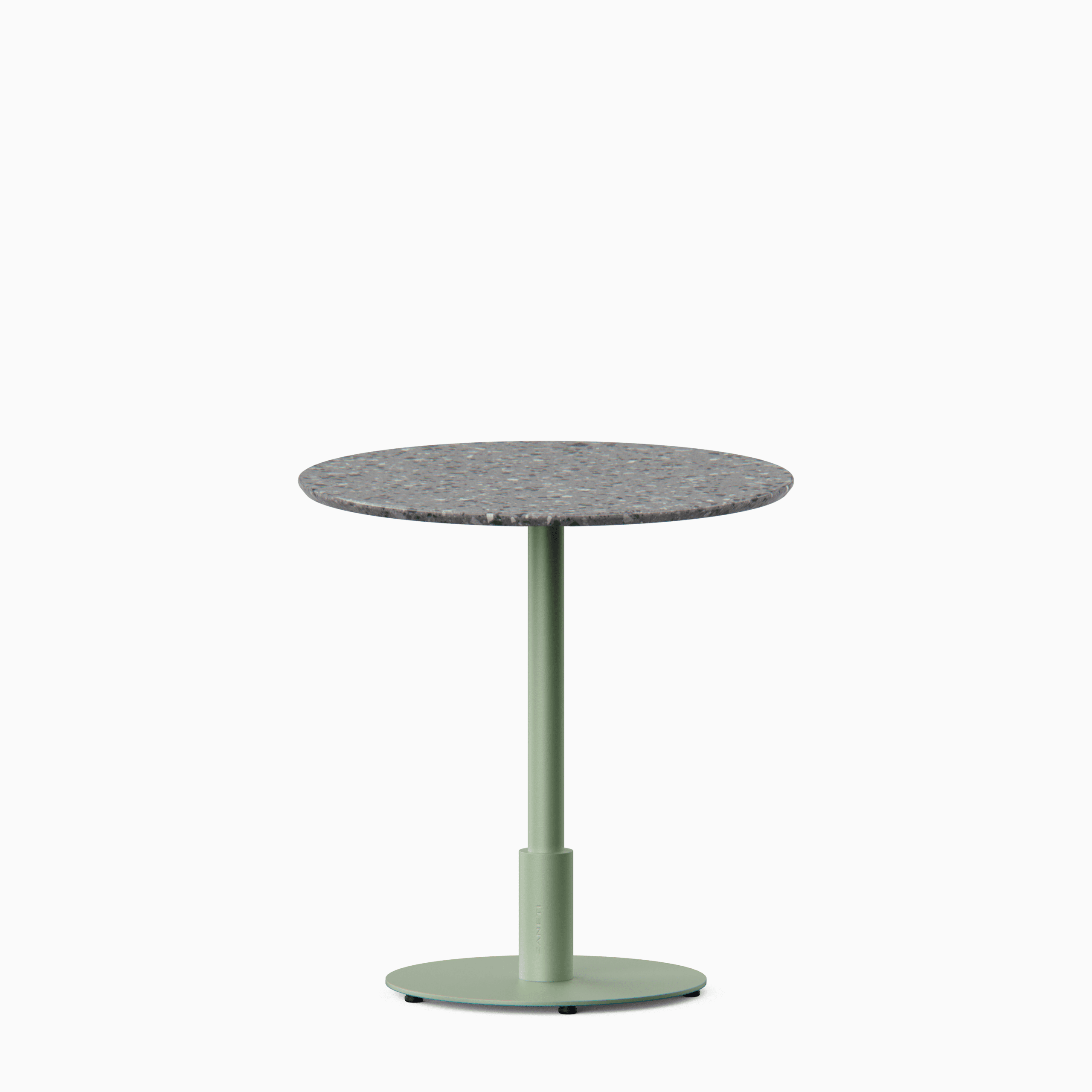 Round dining table with terrazzo top and metal pedestal base.