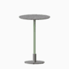 Round bar table with terrazzo top and metal pedestal base.