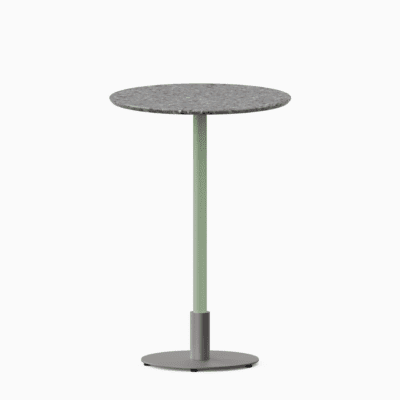 Round bar table with terrazzo top and metal pedestal base.