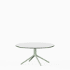 Round dining table with compact‑laminate top and aluminium base