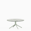 Round dining table with compact‑laminate top and aluminium base