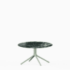 Round dining table with marble top and aluminium base.
