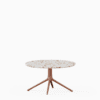 Round coffee table with terrazzo top and aluminium base.”