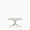 Round coffee table with terrazzo top and aluminium base.”