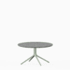 Round coffee table with terrazzo top and aluminium base.”