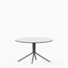 Round compact‑laminate coffee table with aluminium base.