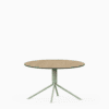 Round compact‑laminate coffee table with aluminium base.