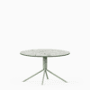 Round compact‑laminate coffee table with aluminium base.