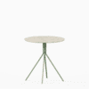 Round terrazzo table with speckled stone top and powdercoated aluminium base.