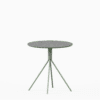 Round terrazzo table with speckled stone top and powdercoated aluminium base.