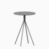 Round terrazzo bar table with speckled stone top and powdercoated aluminium base.
